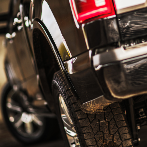 The back of a black pickup truck.